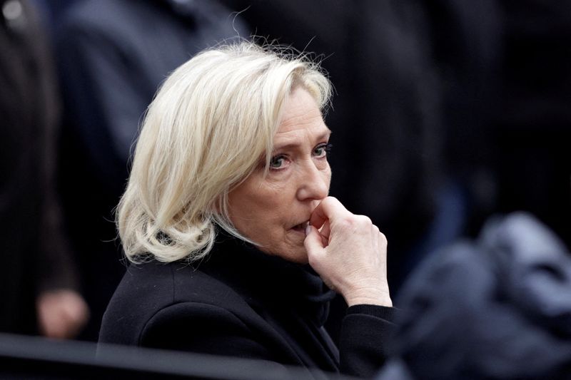 France's Le Pen condemns death threats against those trying her