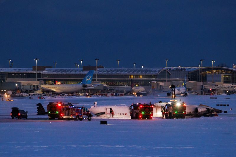 Delta plane flips upside down on landing at Toronto airport, injuring 18