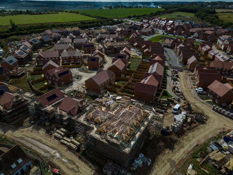 UK house prices dip in February, demand slows, Halifax data shows