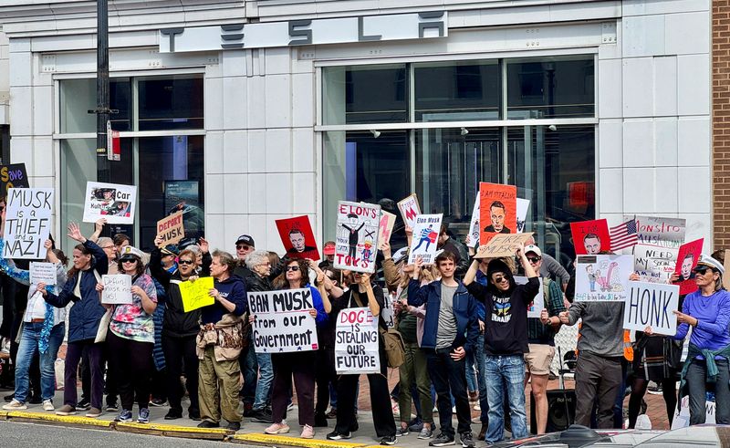 Anti-Musk protesters gather outside Tesla dealership in Washington