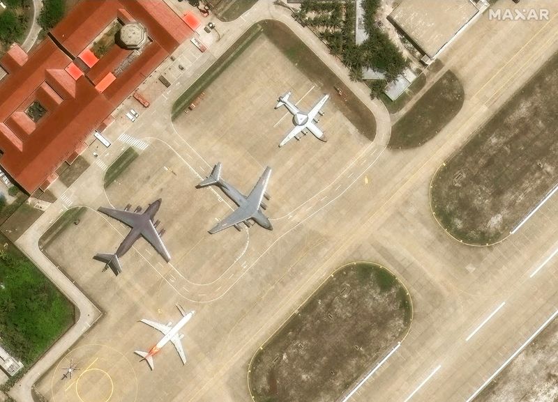 © Reuters. A KJ-500 early warning plane along with Y-20 transport aircraft are parked on the tarmac of an airfield on Woody Island, in the disputed Paracel archipelago, which is known in China as Xisha Islands, South China Sea, May 19, 2025. MAXAR TECHNOLOGIES/Handout via REUTERS