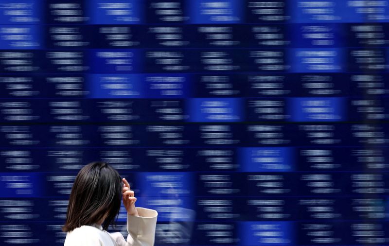 Wall Street jumps, Treasury yields advance as upbeat jobs report eases economic fears