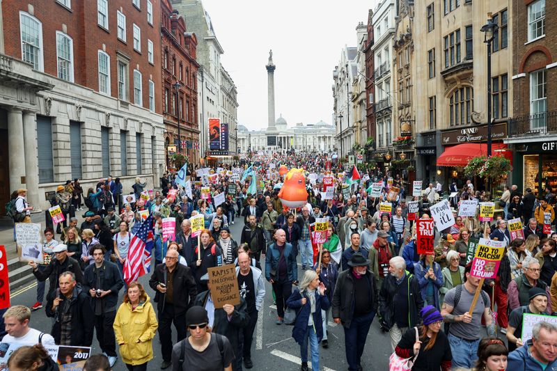 Anti-Trump protesters march through London as president basks in royal welcome