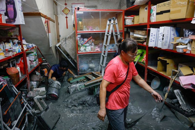 Taiwan rescuers battle thick mud to look for missing from Super Typhoon Ragasa