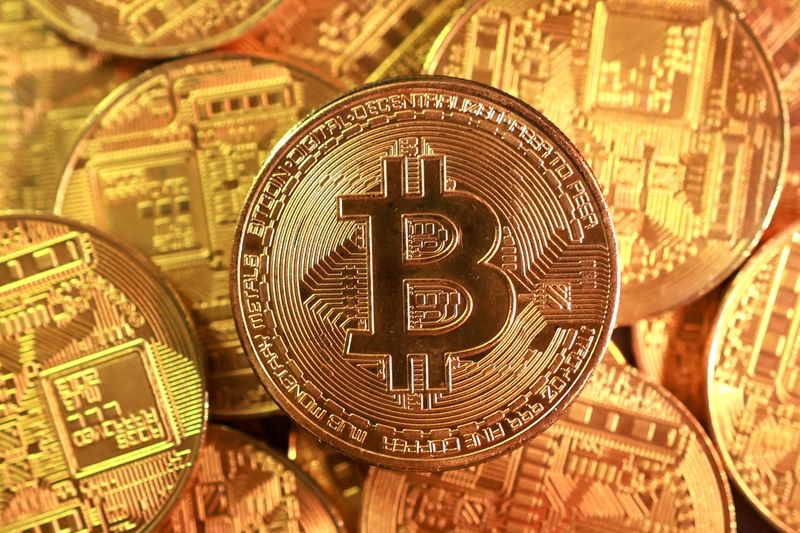 Bitcoin hovers near all-time high