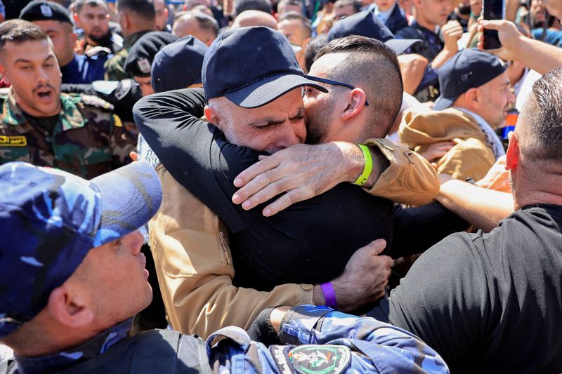 Palestinians cheer as freed prisoners begin to arrive home under ceasefire deal