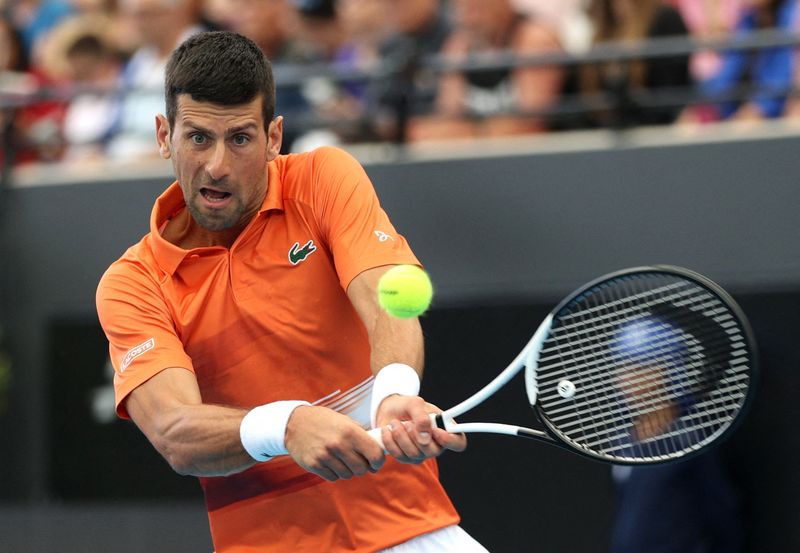 &copy; Reuters. Novak Djokovic en pleine action face à Constant Lestienne. /Photo prise le 3 janvier 2023/REUTERS/Loren Elliott